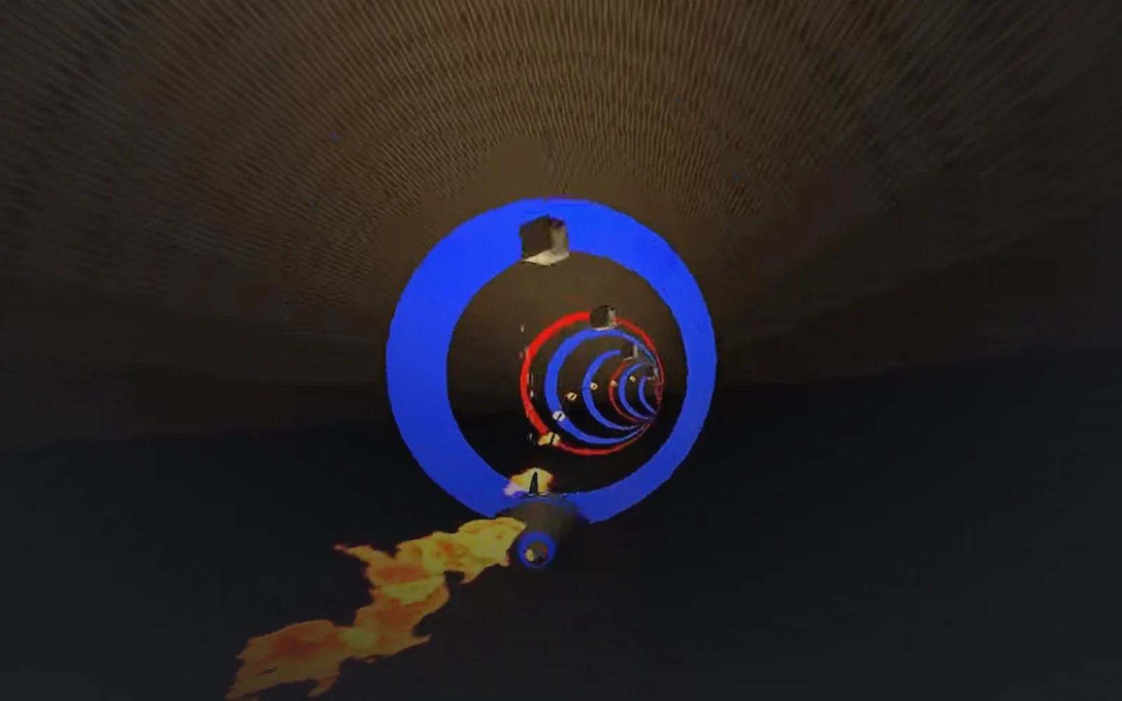Kolorowe pierścienie i kula poruszająca się w tunelu w grze Tunnel Race